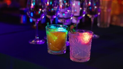 Vivid drinks scene, Artistic cocktail presentation with layered colors and decorative garnishes