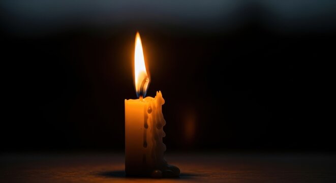 Illuminating Serenity: A solitary candle casting a warm glow in the darkness - Powered by Adobe