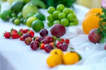 Colorful fruits are arranged on the table at a healthy drink party for the whole family on the weekend.