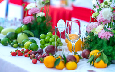 Colorful fruits are arranged on the table at a healthy drink party for the whole family on the weekend.
