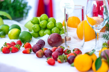 Colorful fruits are arranged on the table at a healthy drink party for the whole family on the weekend.