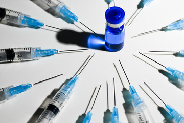 Single Use Syringes With Needles and Vial With Copper Peptides on White Background