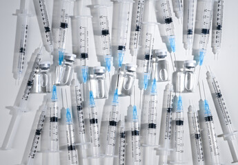 Single Use Syringes with Needles on White Background