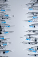 Single Use Syringes with Needles on White Background