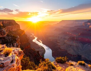 Grand canyon vista at sunset, with river winding through the deep gorge
