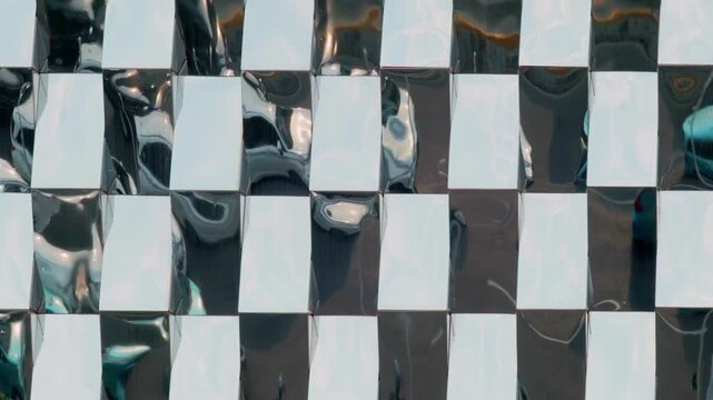 City traffic reflected on a glass building, showing modern urban life, architecture, and movement in a dynamic city environment.