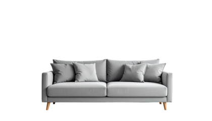Contemporary, light-grey sofa with multiple throw pillows against black backdrop