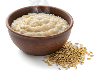 steaming bowl of cooked oatmeal porridge served in a wooden bowl with raw oats on the side