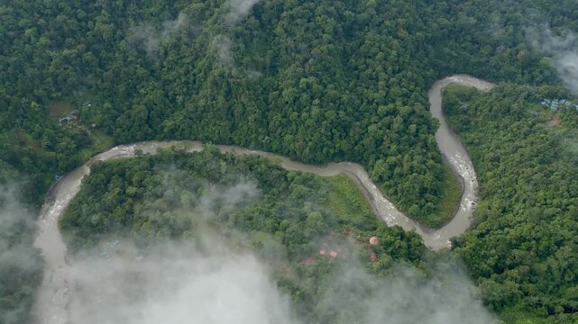 Aerial view of a landscape with the Pacuare River channel in the middle of the humid tropical rainforest in the mountains of Limón province in Costa Rica