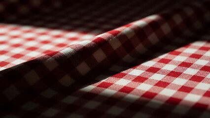 Obraz premium classic red and white checkered fabric texture showing traditional gingham pattern draped for rustic culinary backgrounds or summer picnic themes