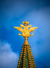 Golden double headed eagle on top of one of the Kremlin tower.