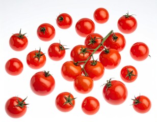 Overhead shot of scattered, vibrant red cherry tomatoes on a white backdrop