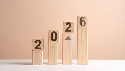 A sequence of wooden blocks with numbers 2, 0, 2, 6 and an upward arrow forms a growing bar chart on a light beige background.