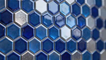 Close-up of blue hexagonal mosaic tiles with reflective surfaces