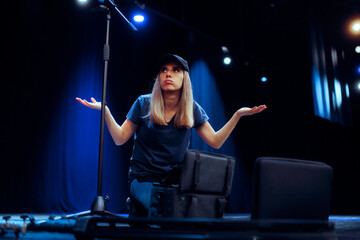 
Professional Stagehand Woman Feeling Puzzled and Confused 

Sound engineer checking her tool bag forgetting something for the show