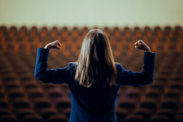 Strong Woman Flexing her Arms Ready to Speak in Public. Powerful female leader feeling brave and motivated before symposium