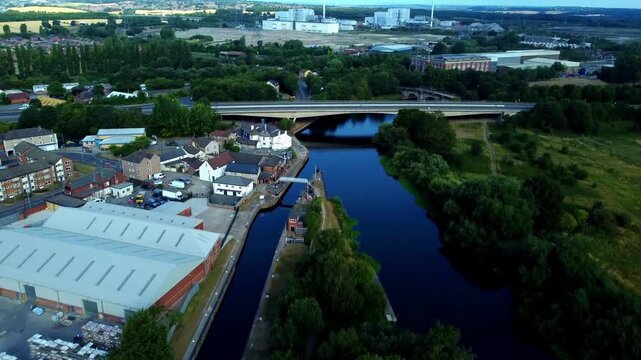 Aerial view following Aire and Calder Canal toward demolished Ferrybridge Power Station location