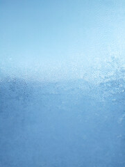 Texture of fogged glass, abstract blue background.