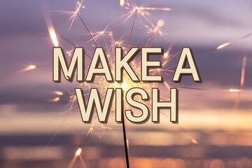 Sparkling sparkler with make a wish text at sunset