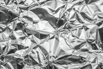 Shiny metal silver gray foil leaf crumpled texture background