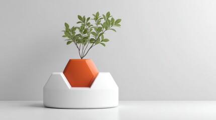 Modern geometric planter with green plant arranged on minimalistic white background showcasing contemporary design elements and stylish home decor inspiration