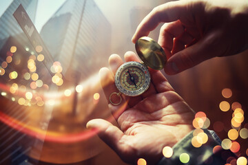 Double exposure businessman with vintage compass in a hand and skyscraper.  concept to make decision or choose direction
