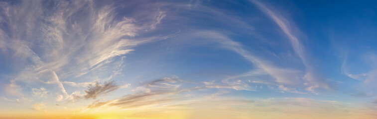 Stunning Cloudscape Of A Clear Blue Sky With Soft Wispy Clouds At Sunset