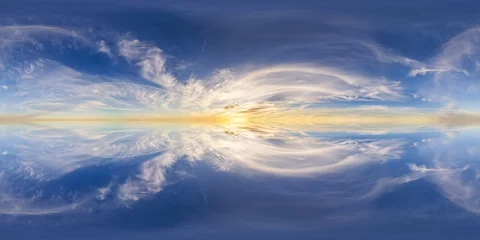 Poster Reflectie Golden Sunrise Over A Vast Cloudscape Reflected On A Glassy Ocean Surface In Blue Sky  © edb3_16