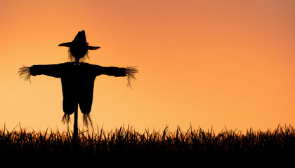 Scarecrow silhouette over cornfield at orange sunset, eerie rural harvest scene