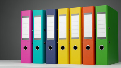 A minimalist shot showcases seven vibrant, upright ring binders in a row on a white shelf against a gray background