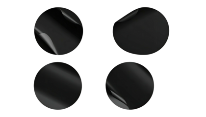 Four black sticker circles; corners peeled