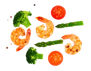 Colorful Grilled Shrimp with Fresh Broccoli Tomato and Asparagus on a Black Background