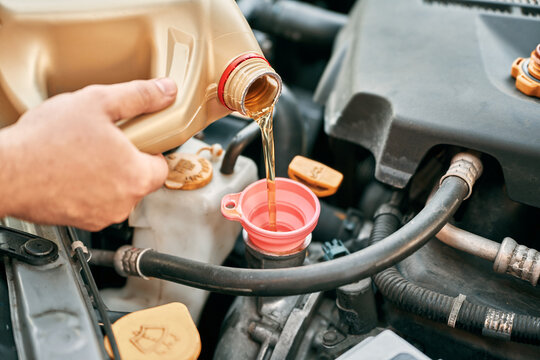 Auto repair oil refill under hood