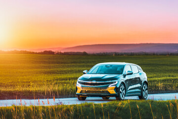 Electric vehicle driving on quiet road