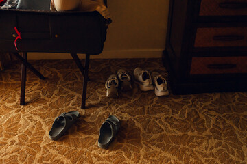 Shoes Resting on Carpet in Warm Evening Light