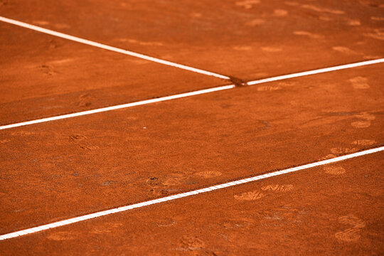 Footprints on a clay tennis court