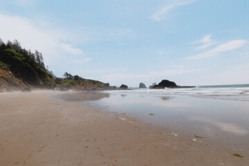 Empty Indian Beach with rock outcroppings offshore in Oregon