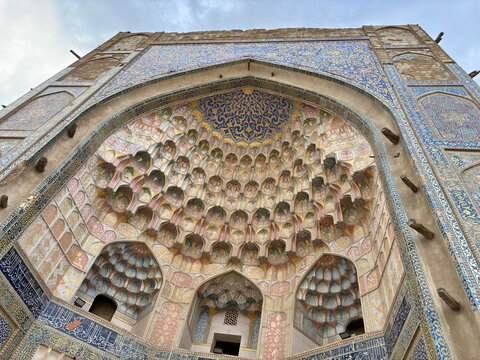 Ornate muqarnas & mosaic portal of Abdulaziz Khan Madrasah in Bukhara