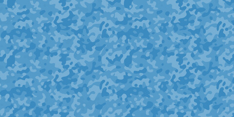 Abstract blue camouflage pattern with irregular shapes and varying tones © Ripan