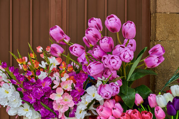Colorful floral arrangement with pink flowers at a local stall