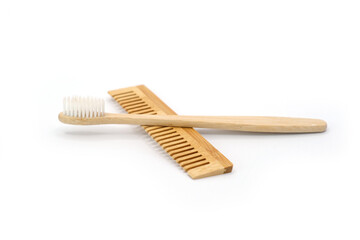 Natural Wooden Toothbrush and Comb on White Background