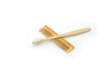 Natural Wooden Toothbrush and Comb on White Background