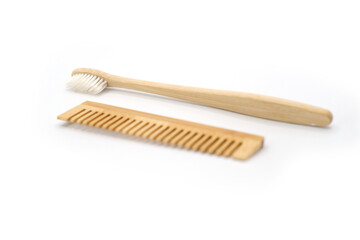 Natural Wooden Toothbrush and Comb on White Background