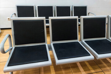 Black chairs lined up neatly in the room
