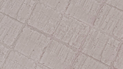 Close-up texture of cracked earth or dry mud with a repeating geometric pattern, suggestive of drought or arid conditions