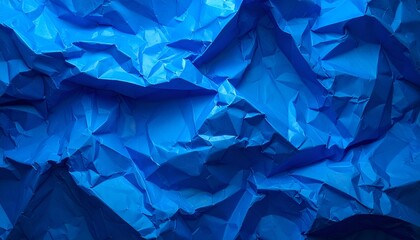 Close-up of intensely crumpled, vibrant blue paper surface (1)