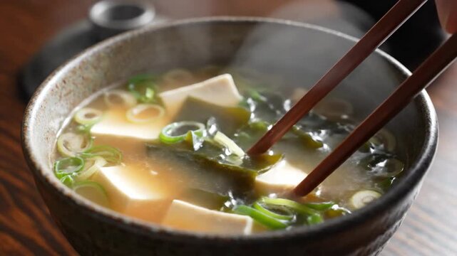 Close up of traditional japanese miso soup with tofu and seaweed