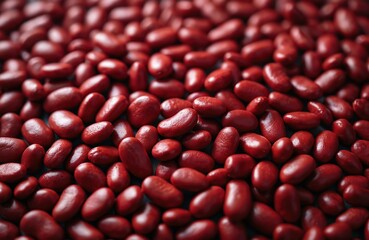 Close-up macro shot of raw red kidney beans filling frame. Uniform texture repeats across surface, showing uncooked legumes dry and ready for cooking.