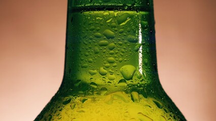 Green beer bottle showing cold condensation drops