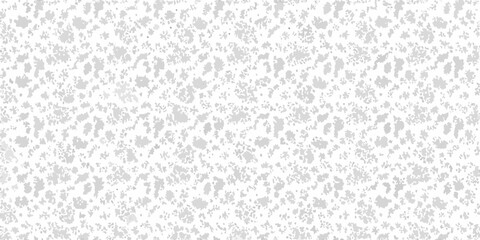 Subtle grainy texture with scattered dark speckles on a light gray background